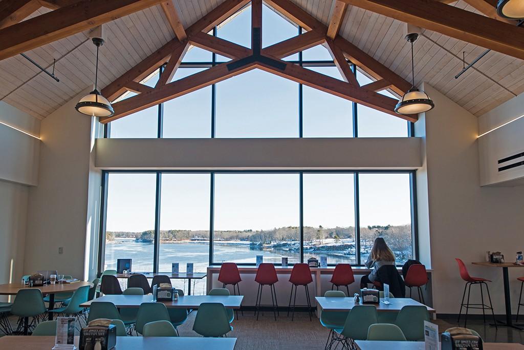 的 inside of the dining hall in the Commons overlooking the Saco River