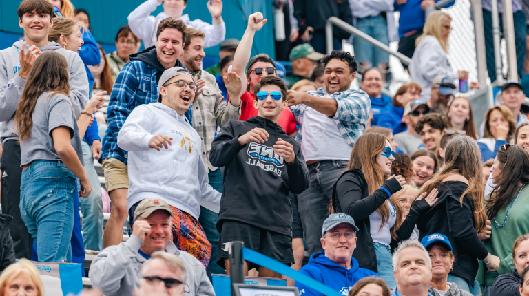 Fans cheer on the team