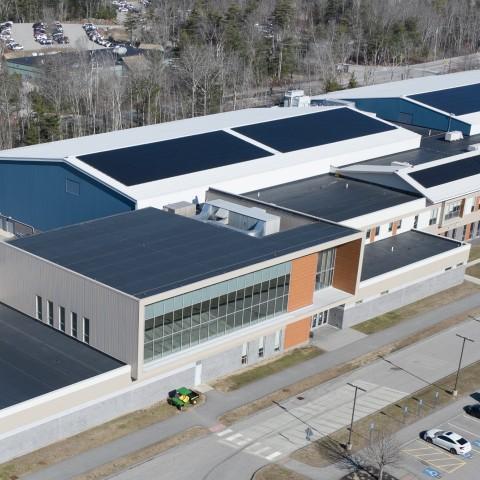 Aerial image of solar panels atop the Harold Alfond Forum